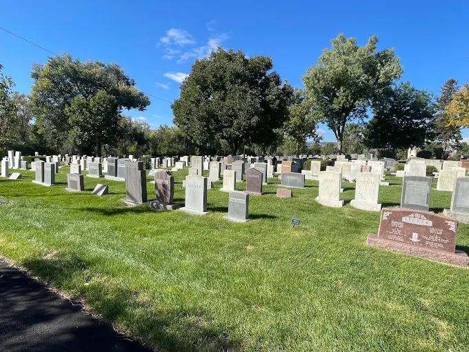 Sunlit rows of headstones at Golden Hill Cemetery in Lakewood, Colorado